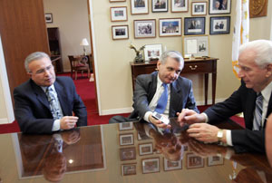 Reed shows a photo of his one-year-old daughter, Emily, on his Blackberry, to Richard Fossa, chief of staff to North Providence Mayor Charles Lombardi, left, in his Capitol office. "Before you know it, this kid'll be in college," the mayor told him. Journal photo / Mary Murphy Reed shows a photo of his one-year-old daughter, Emily, on his Blackberry, to Richard Fossa, chief of staff to North Providence Mayor Charles Lombardi, left, in his Capitol office. "Before you know it, this kid'll be in college," the mayor told him. Journal photo / Mary Murphy