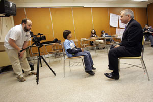 William Flores, 10, asks Senator Reed about his memories of the late Rev. Martin Luther King Jr., during a celebration honoring the civil rights leader at Woonsocket High School. Daniel Lee White is taping the interview. Whenever Reed comes home to Rhode Island, he keeps busy meeting constituents from across the state. Journal photo / Mary Murphy William Flores, 10, asks Senator Reed about his memories of the late Rev. Martin Luther King Jr., during a celebration honoring the civil rights leader at Woonsocket High School. Daniel Lee White is taping the interview. Whenever Reed comes home to Rhode Island, he keeps busy meeting constituents from across the state. Journal photo / Mary Murphy